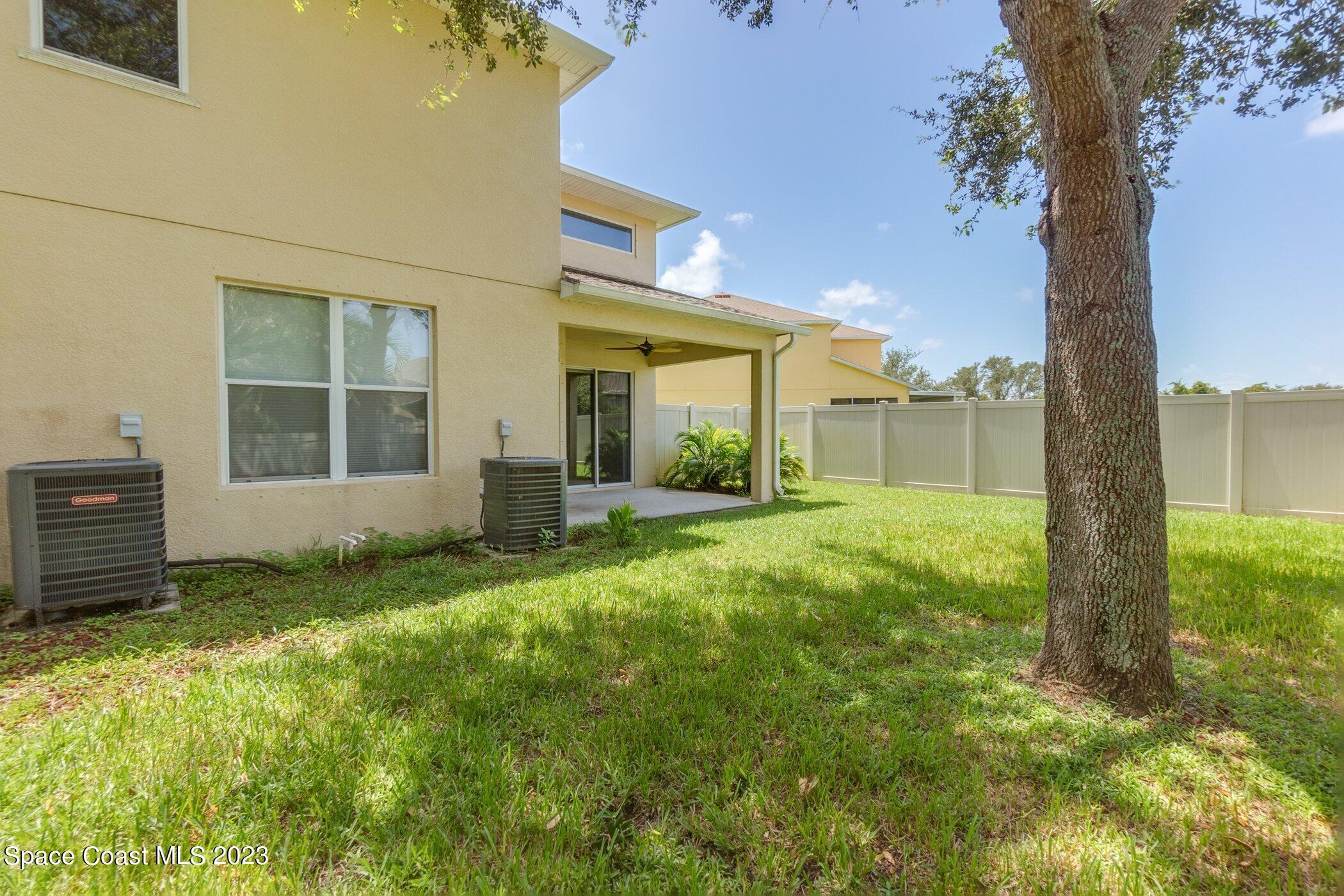 3194 Arden Circle Melbourne, FL 32934 - Photo 5 of 40 a view of a house with backyard and garden