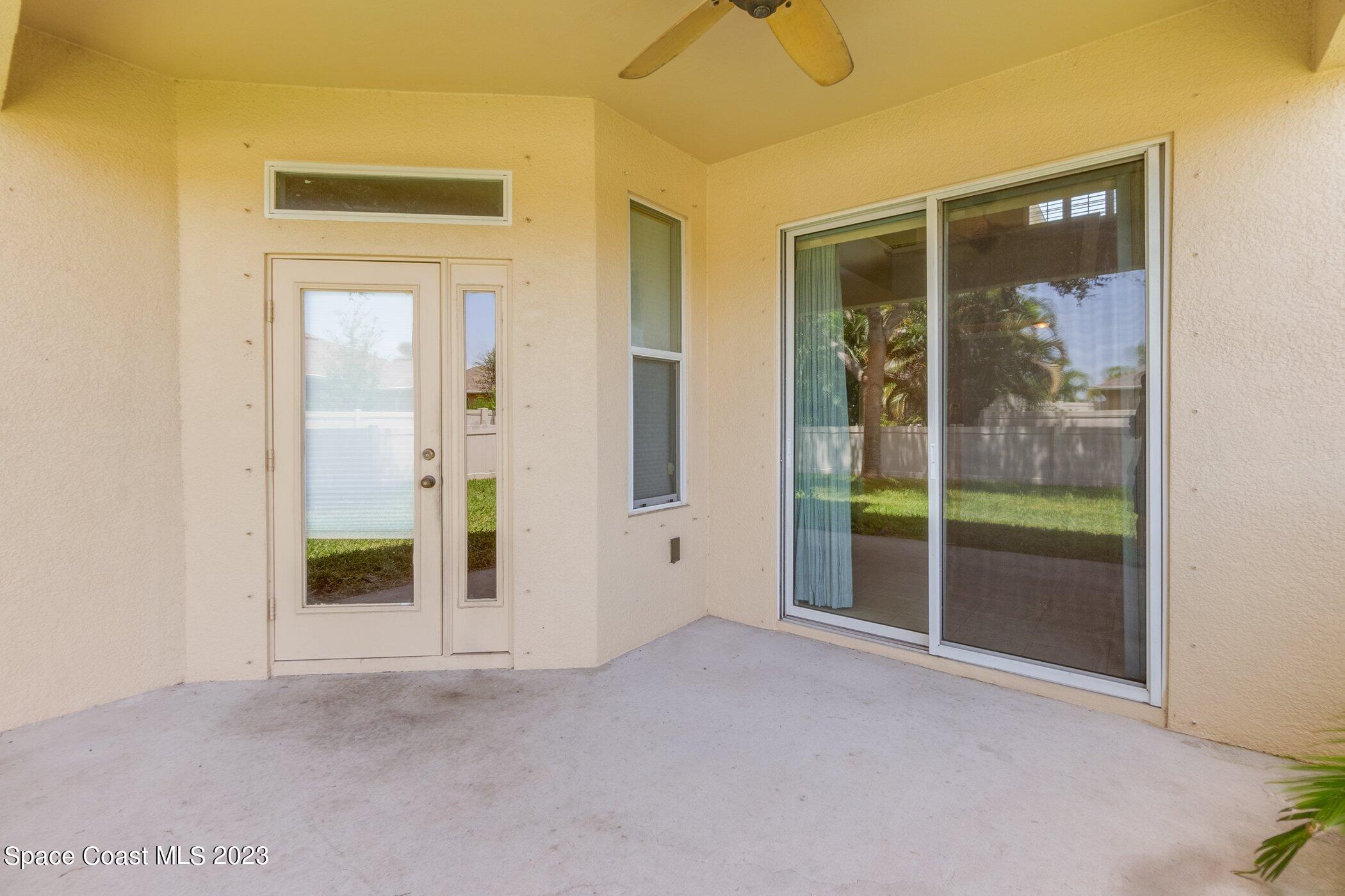 3194 Arden Circle Melbourne, FL 32934 - Photo 6 of 40 wooden floor and window in an empty room