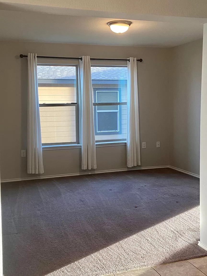 9016 Ridgewell Road Austin, TX 78747 - Photo 15 of 30 Well-lit room with ample natural light from multiple windows, perfect for versatile living.