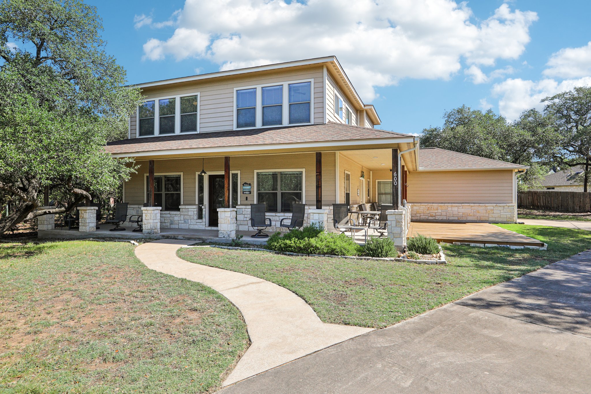 600 Augusta Circle Point Venture, TX 78645 - Photo 2 of 38 a front view of a house with garden and porch