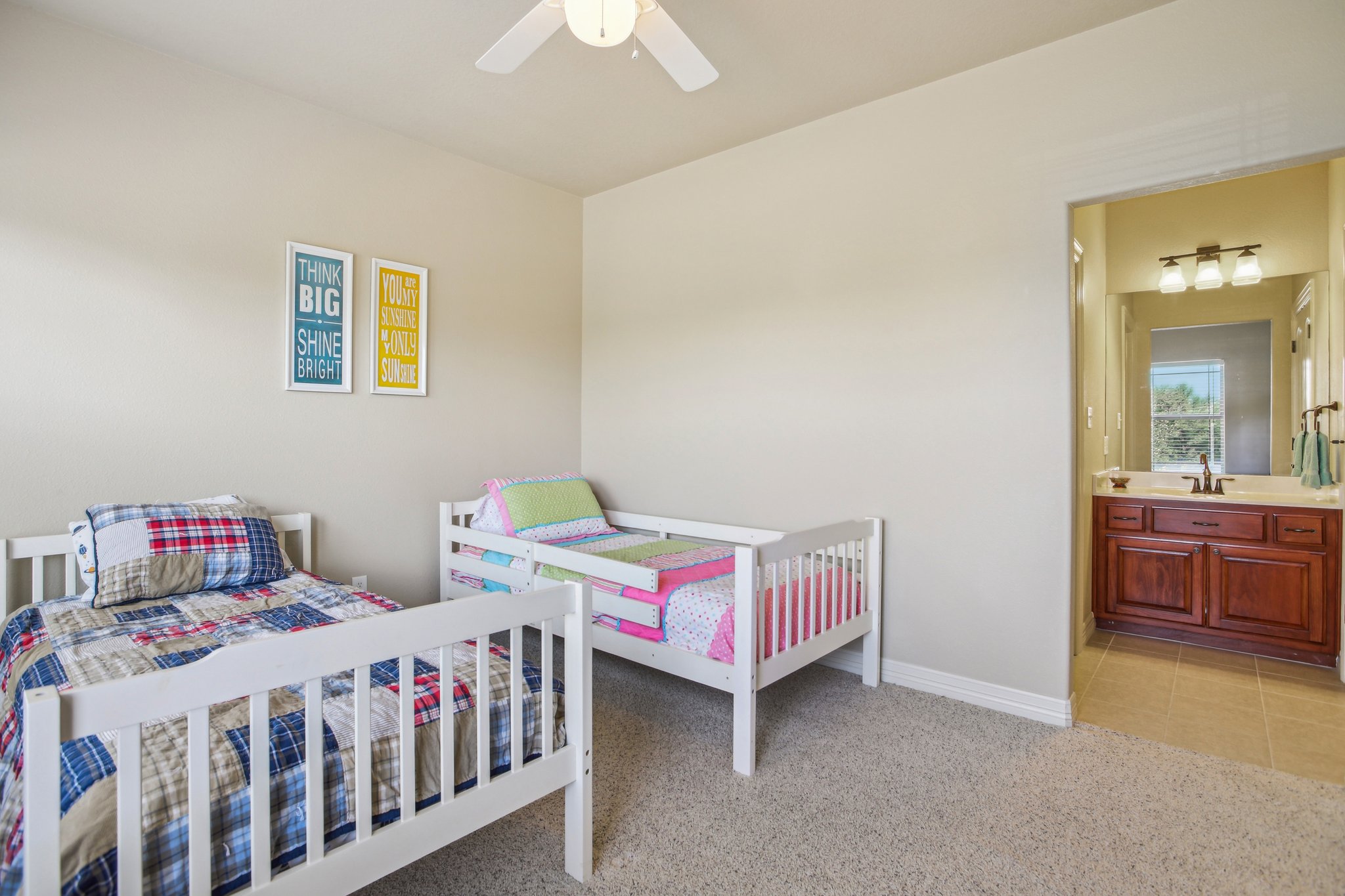 600 Augusta Circle Point Venture, TX 78645 - Photo 27 of 38 a bedroom with a bed and a table in it