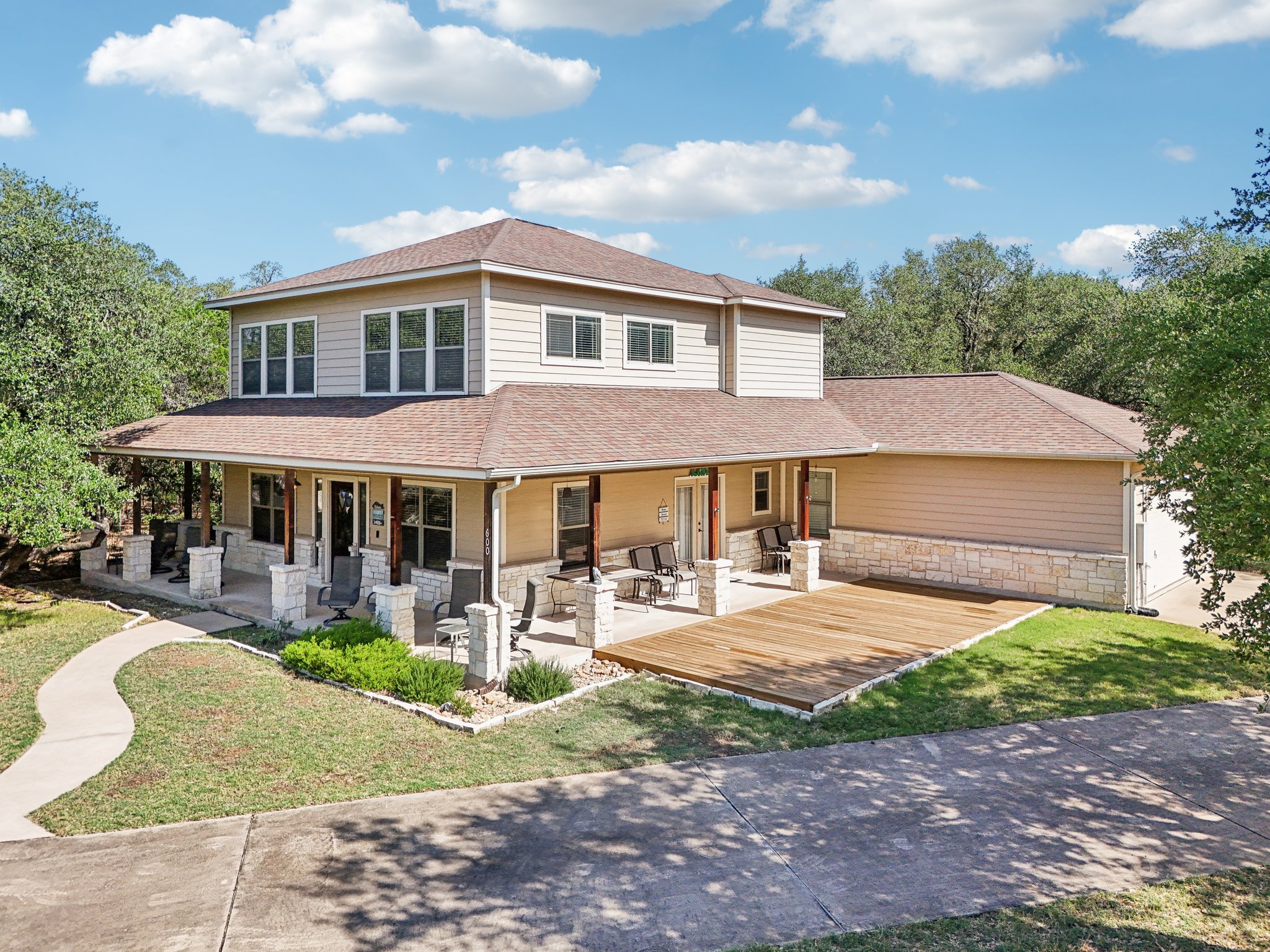 600 Augusta Circle Point Venture, TX 78645 - Photo 37 of 38 a front view of a house with garden and patio