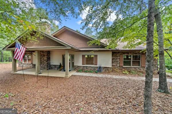 a house with trees in the background