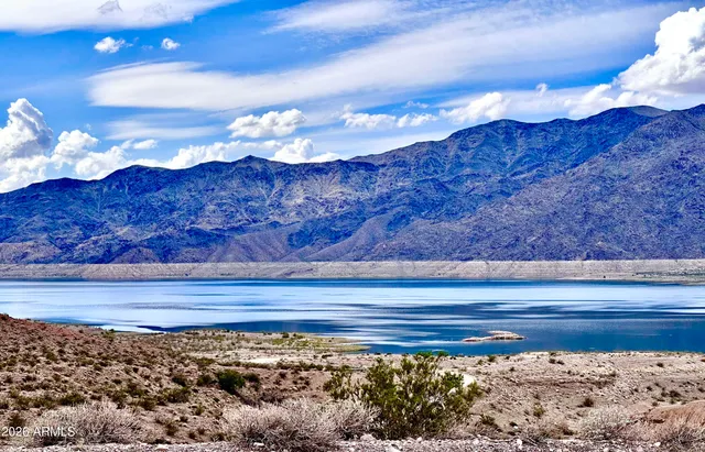 a view of mountains in middle of the field