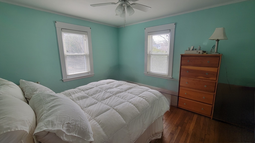 31 Plymouth Road Needham, MA 02492 - Photo 13 of 22 a bedroom with a bed and a window