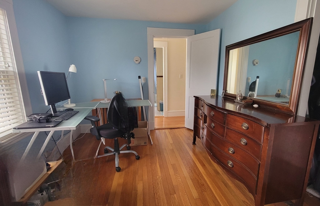 31 Plymouth Road Needham, MA 02492 - Photo 15 of 22 a view of a workspace with furniture and mirror