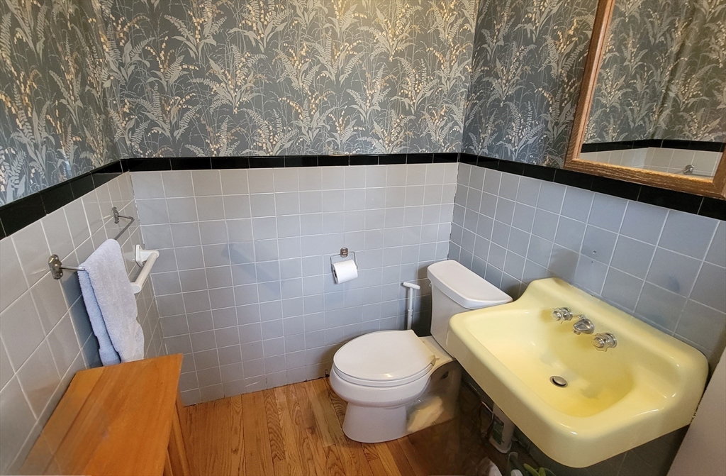 31 Plymouth Road Needham, MA 02492 - Photo 16 of 22 a bathroom with a sink and a toilet