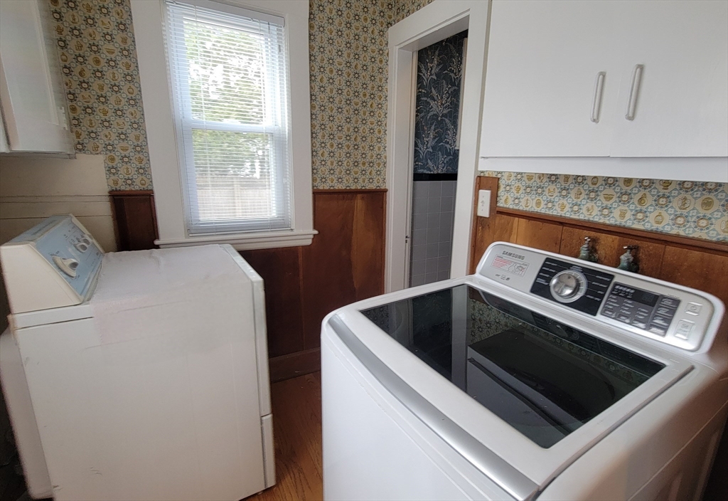 31 Plymouth Road Needham, MA 02492 - Photo 9 of 22 a utility room with dryer and washer