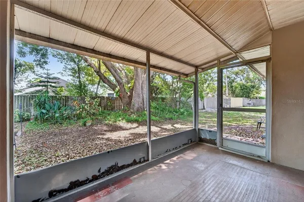 a view of a house with a tree