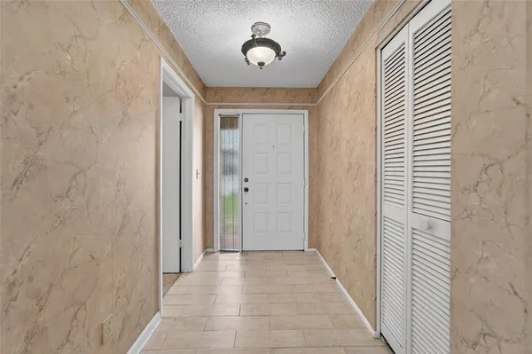 a view of a hallway with entryway