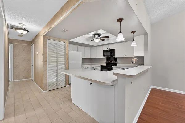 a kitchen with a sink a stove and refrigerator
