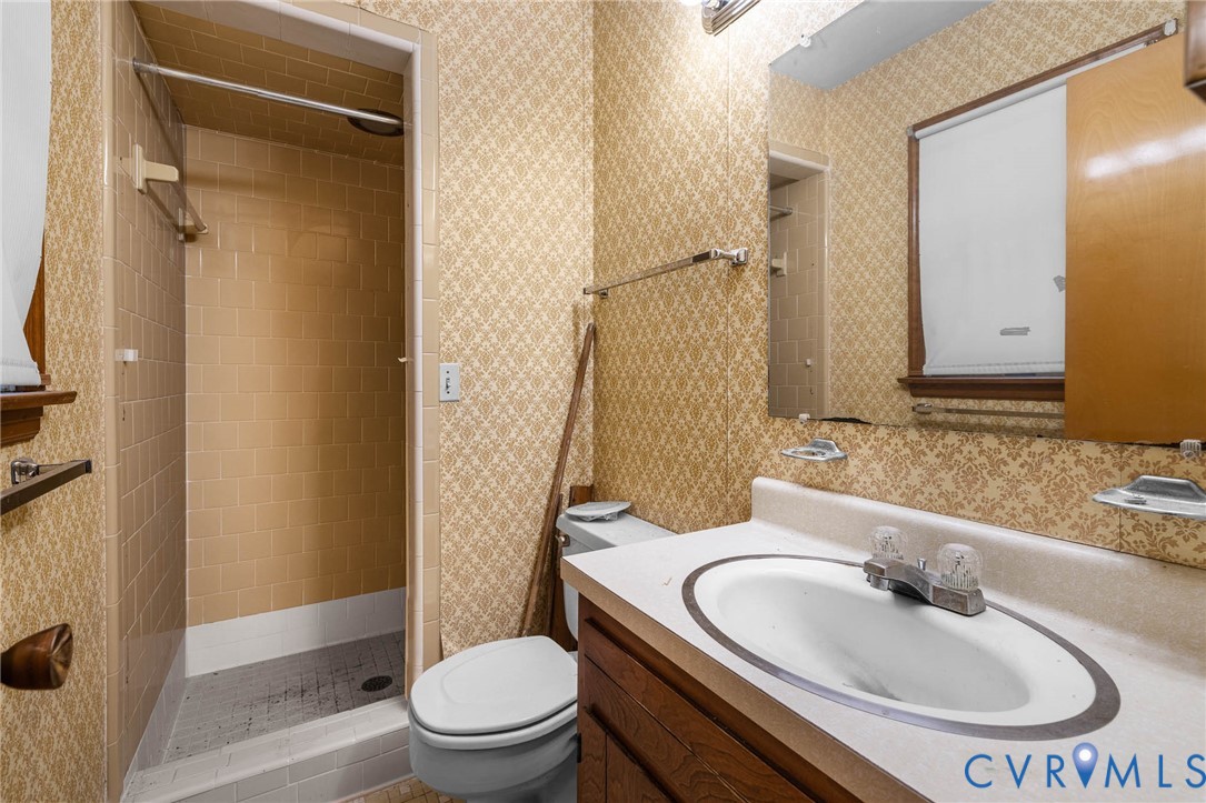 24925 Smith Grove Road Petersburg, VA 23803 - Photo 14 of 19 Bathroom with vanity, a stall shower, and wallpape