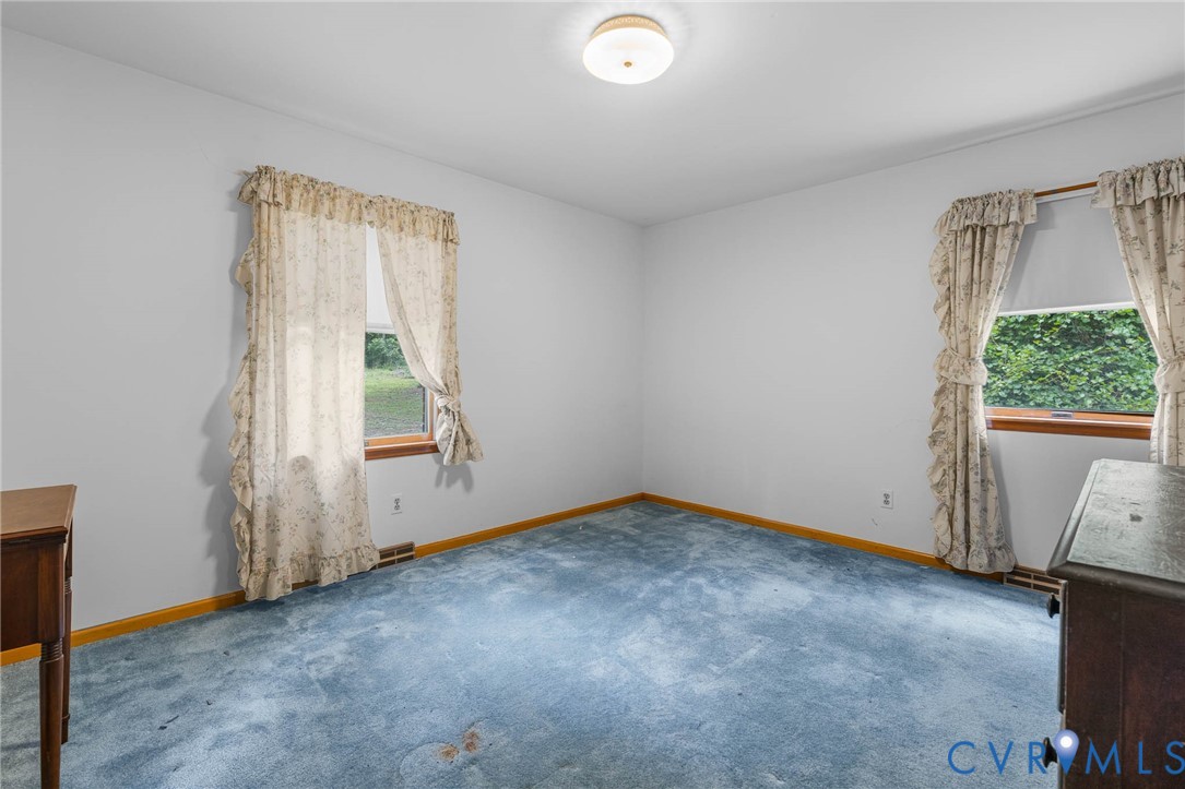 24925 Smith Grove Road Petersburg, VA 23803 - Photo 15 of 19 Carpeted spare room featuring baseboards