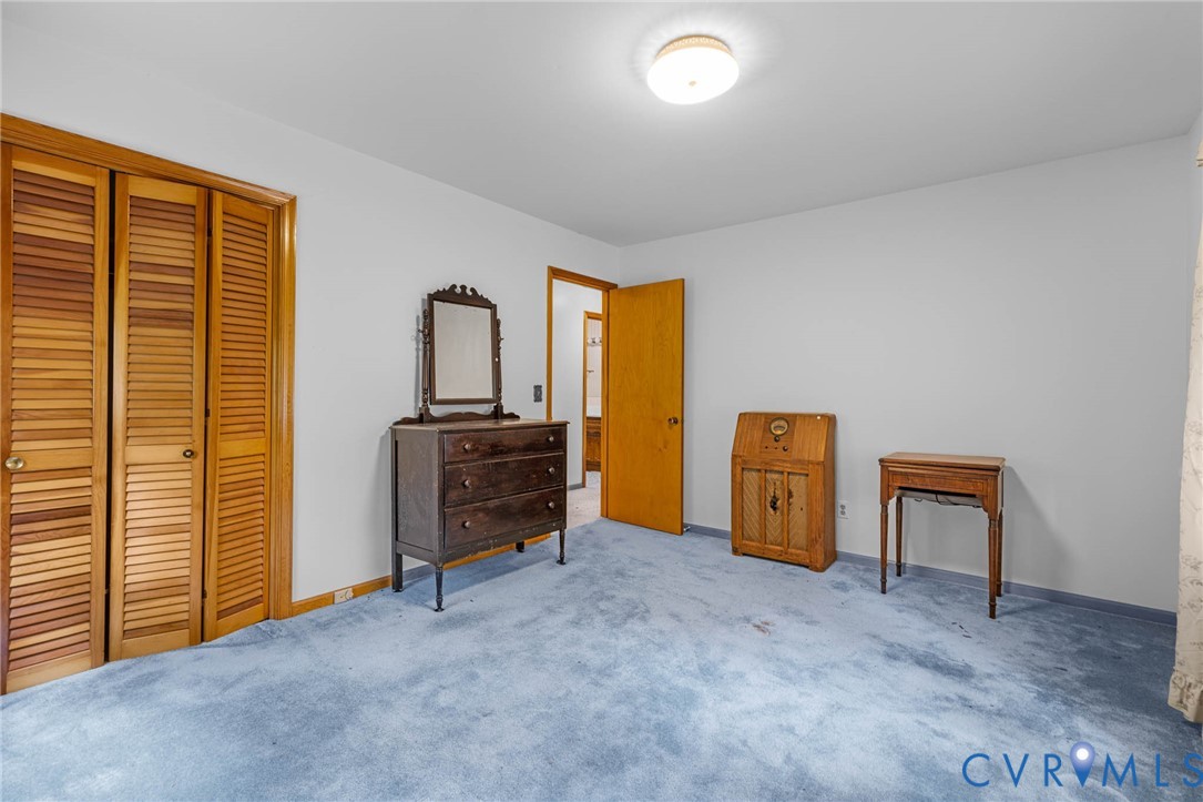 24925 Smith Grove Road Petersburg, VA 23803 - Photo 16 of 19 Carpeted bedroom with baseboards and a closet