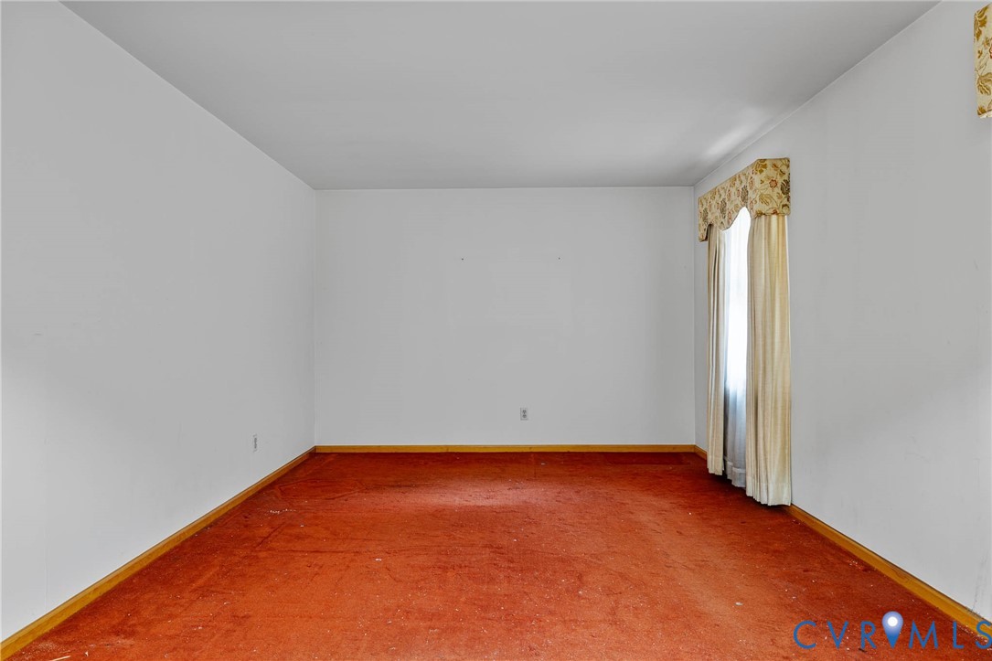 24925 Smith Grove Road Petersburg, VA 23803 - Photo 2 of 19 Carpeted empty room with baseboards