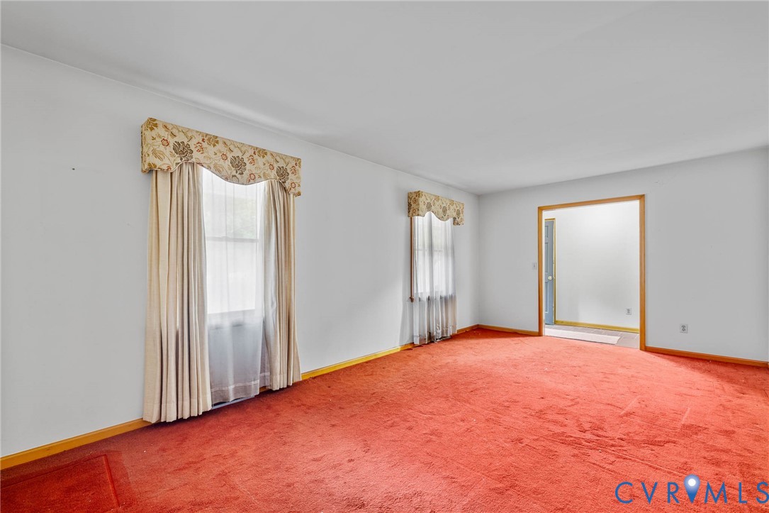 24925 Smith Grove Road Petersburg, VA 23803 - Photo 3 of 19 Spare room featuring baseboards and light carpet