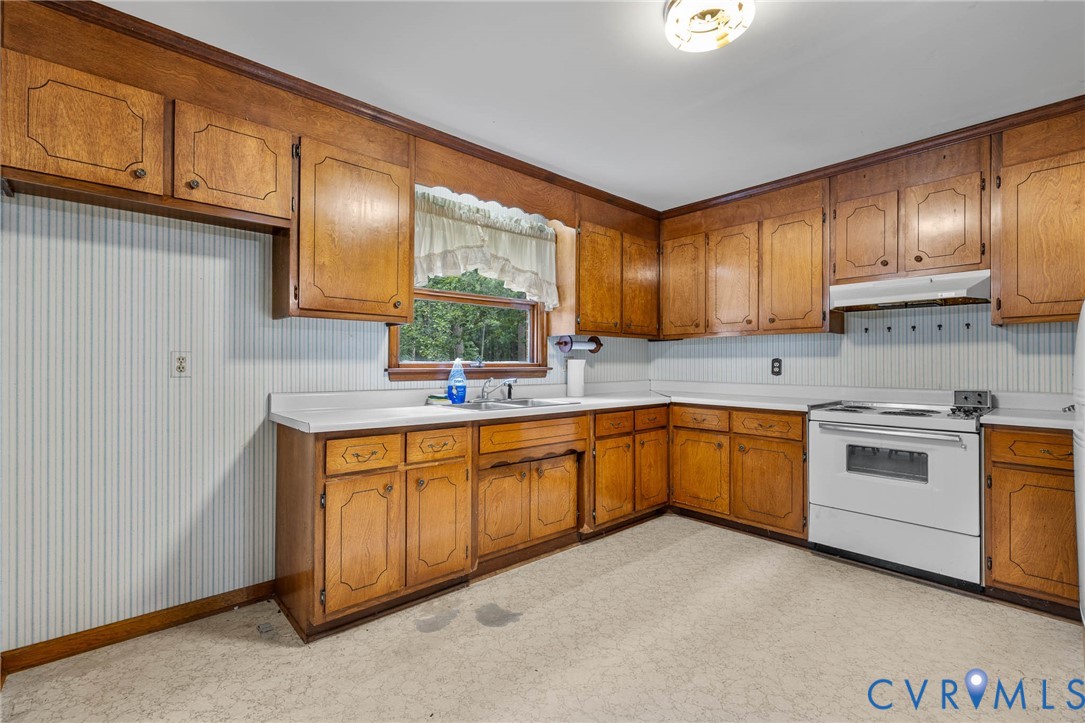 24925 Smith Grove Road Petersburg, VA 23803 - Photo 7 of 19 Kitchen featuring brown cabinetry, white electric