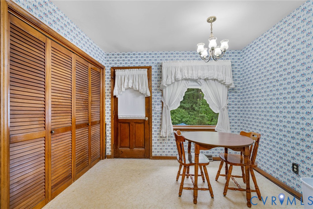 24925 Smith Grove Road Petersburg, VA 23803 - Photo 8 of 19 Dining room featuring wallpapered walls and a chan