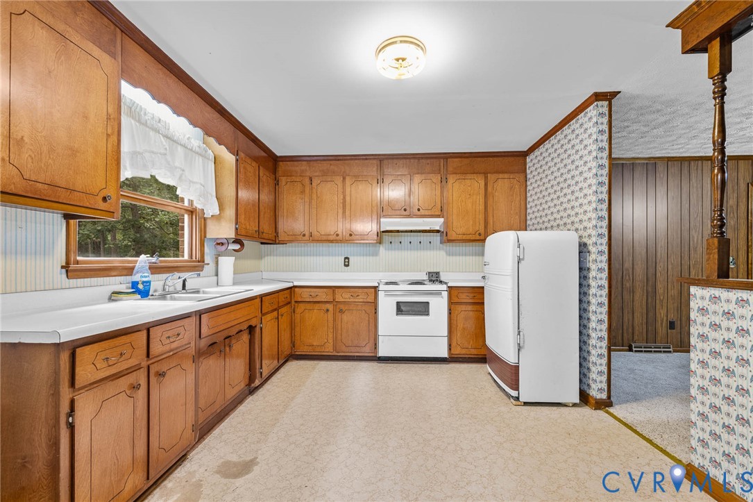 24925 Smith Grove Road Petersburg, VA 23803 - Photo 10 of 19 Kitchen with refrigerator, wallpapered walls, ligh