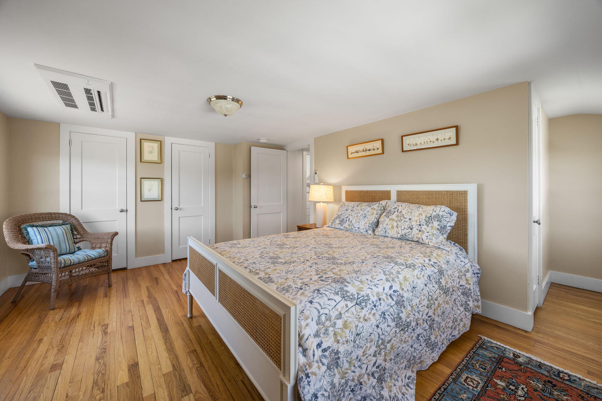 58 Stepping Stones Road Chatham, MA 02633 - Photo 25 of 52 a bedroom with a bed and wooden floor