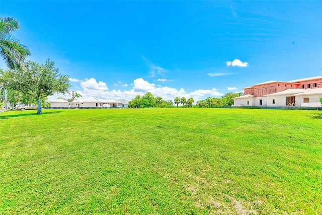 a view of a balcony with lake view and a floor to ceiling window