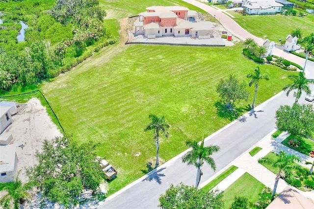 a view of a garden with a building in the background