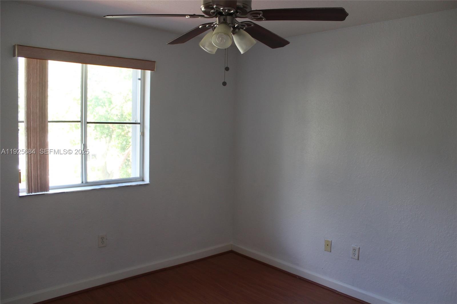 3433 Southwest 171st Terrace, Unit 3433 Miramar, FL 33027 - Photo 11 of 22 an empty room with a window