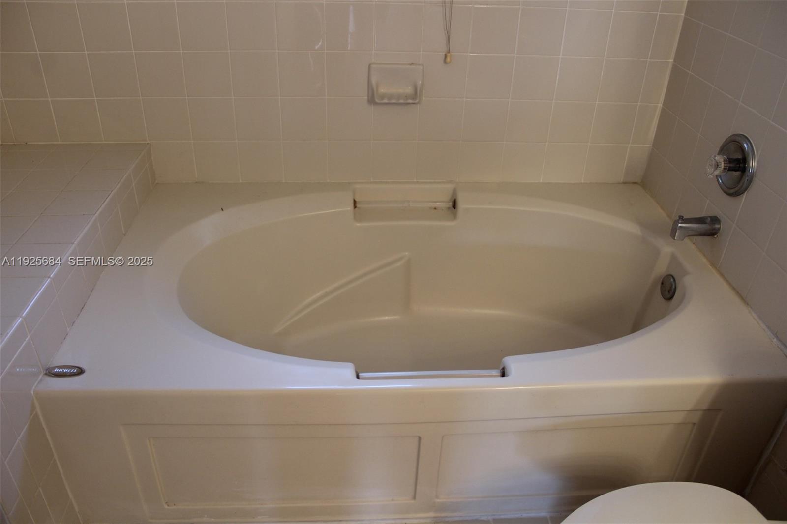 3433 Southwest 171st Terrace, Unit 3433 Miramar, FL 33027 - Photo 20 of 22 a bathroom with a bathtub