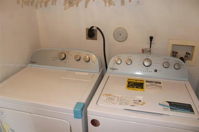a utility room with washer and dryer
