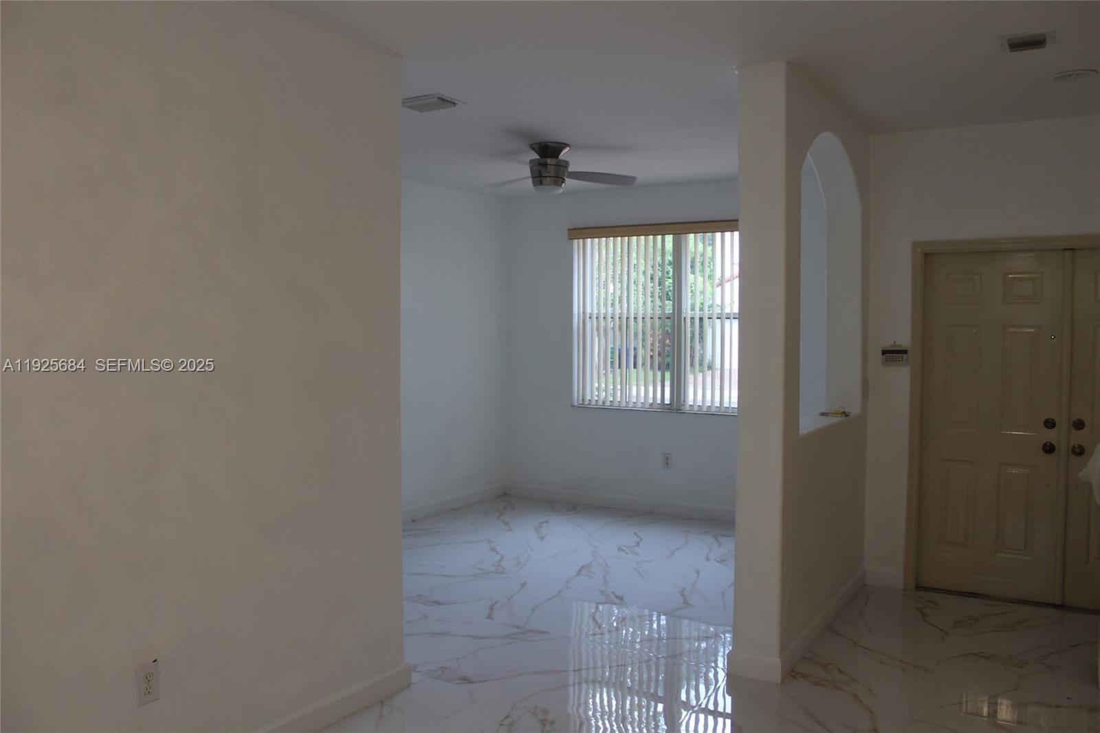 3433 Southwest 171st Terrace, Unit 3433 Miramar, FL 33027 - Photo 4 of 22 a view of an empty room with a window
