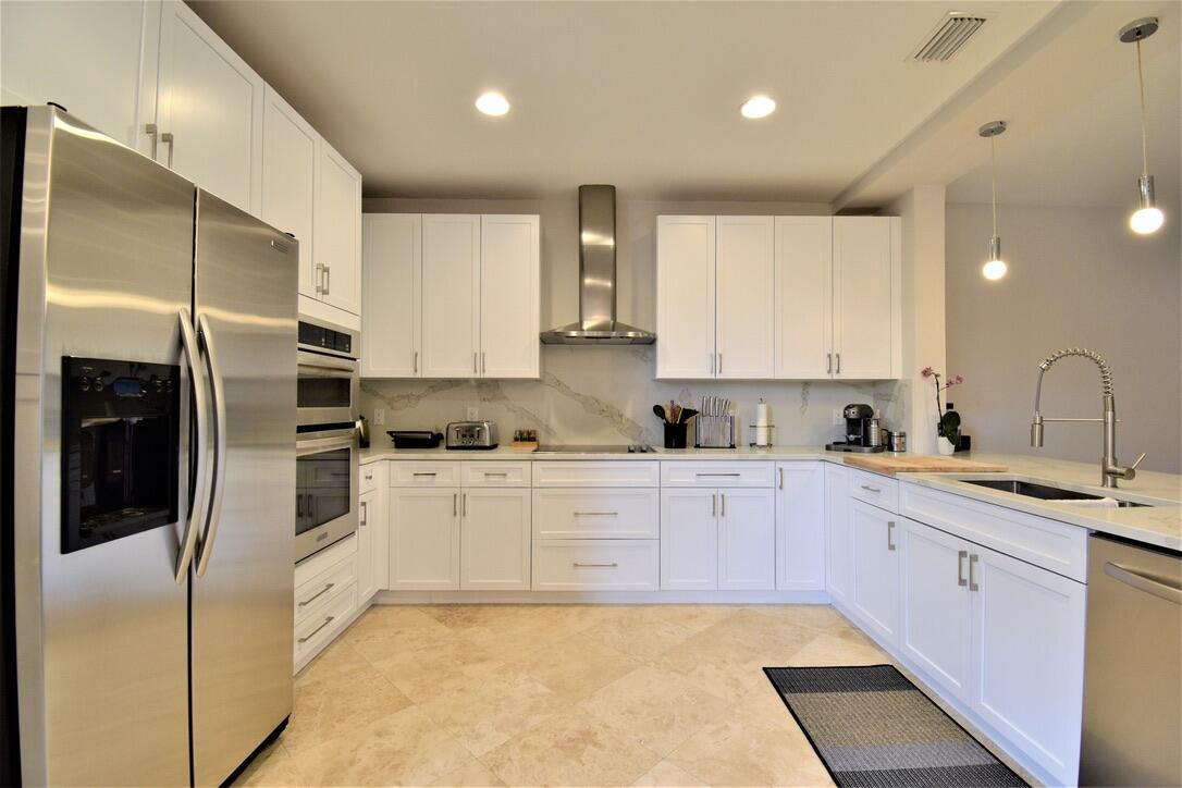 4866 Northwest 16th Avenue Boca Raton, FL 33431 - Photo 19 of 67 a large kitchen with stainless steel appliances granite countertop a refrigerator and a sink