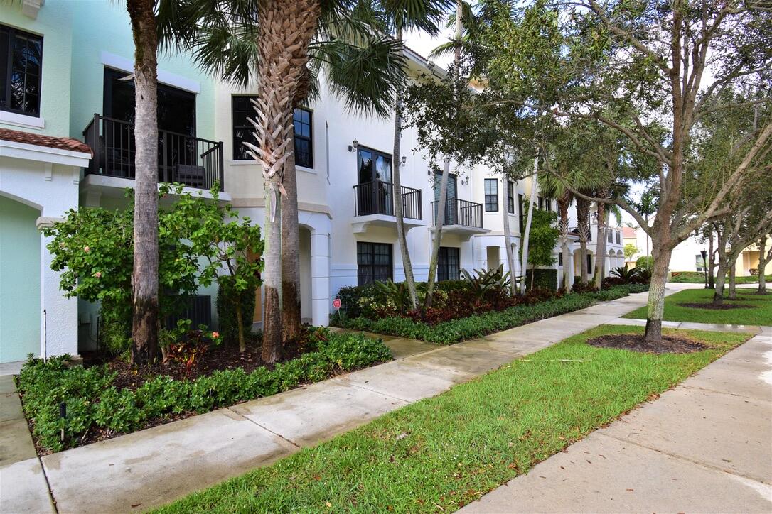 4866 Northwest 16th Avenue Boca Raton, FL 33431 - Photo 2 of 67 a front view of a house with a garden