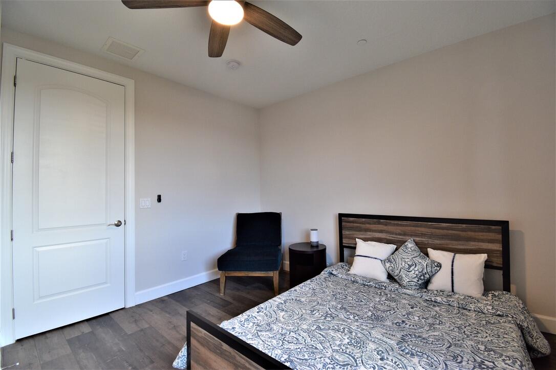 4866 Northwest 16th Avenue Boca Raton, FL 33431 - Photo 30 of 67 a bedroom with a bed and lamps