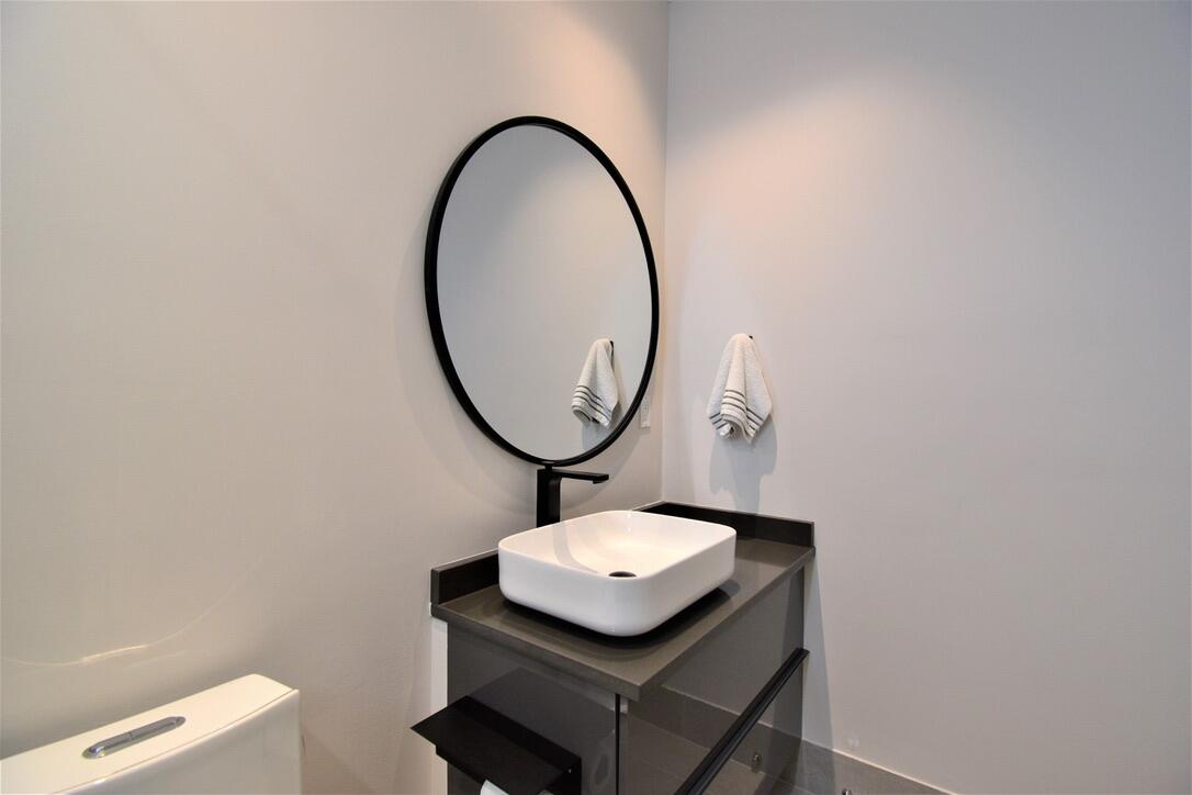 4866 Northwest 16th Avenue Boca Raton, FL 33431 - Photo 34 of 67 a bathroom with a sink a mirror and a toilet