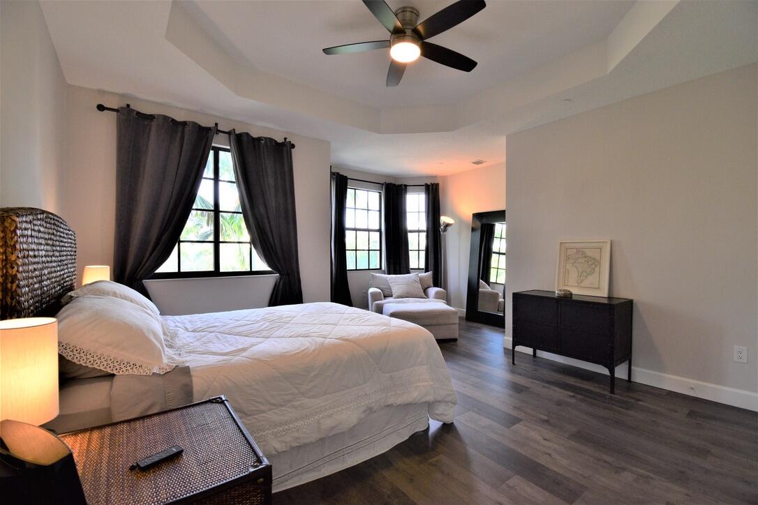 4866 Northwest 16th Avenue Boca Raton, FL 33431 - Photo 36 of 67 a bedroom with a bed and a window
