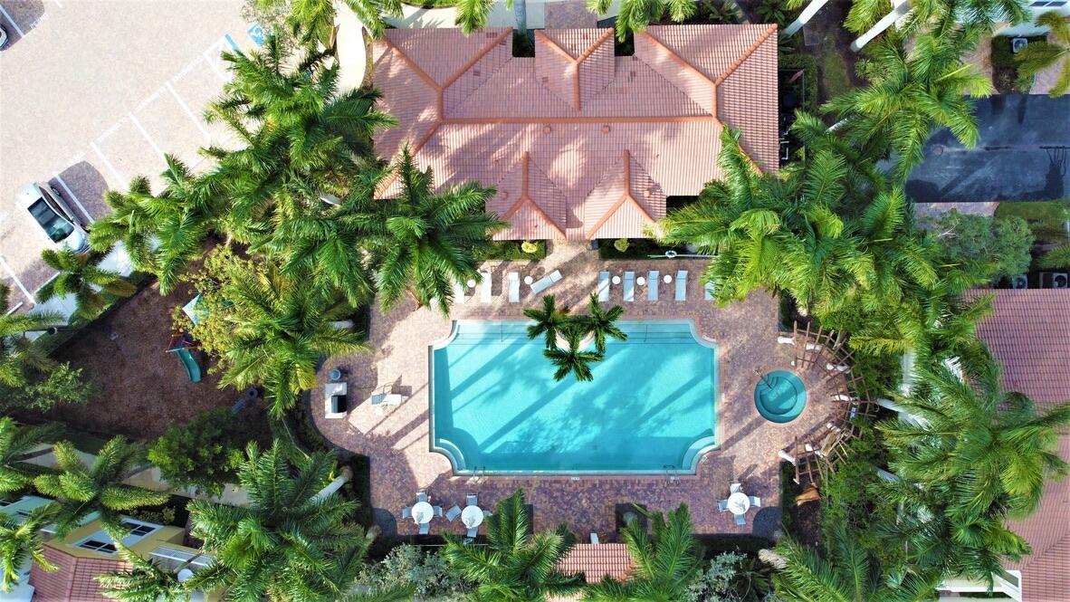 4866 Northwest 16th Avenue Boca Raton, FL 33431 - Photo 49 of 67 an aerial view of residential house with outdoor space and trees all around