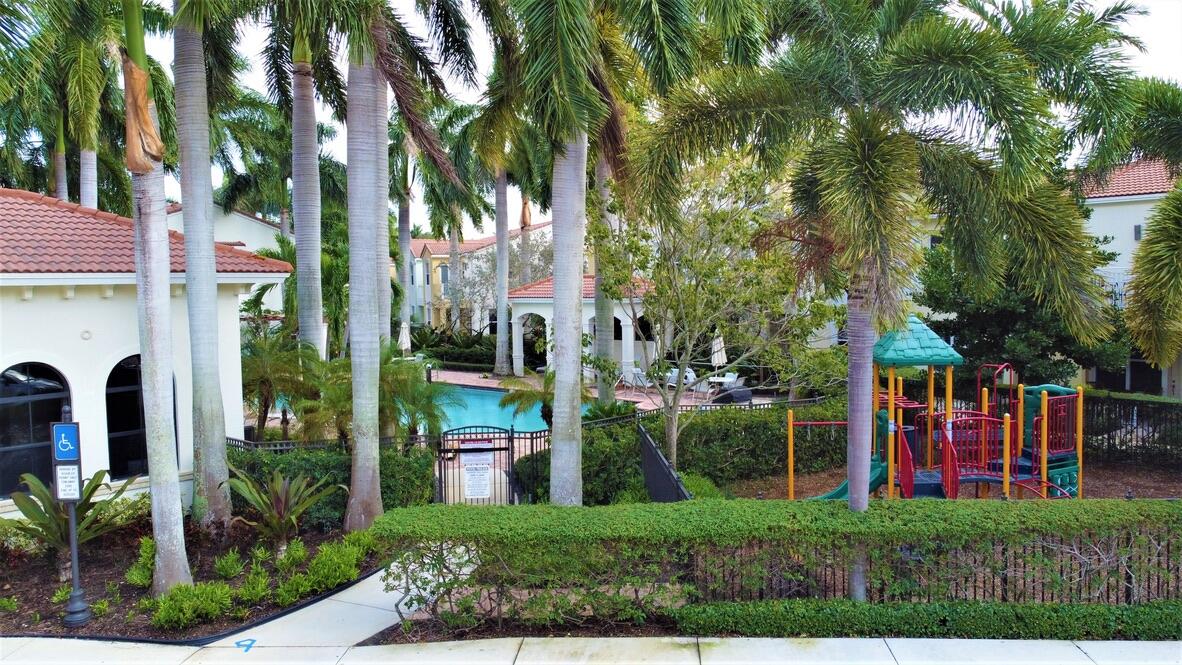 4866 Northwest 16th Avenue Boca Raton, FL 33431 - Photo 59 of 67 a view of front of house with a yard