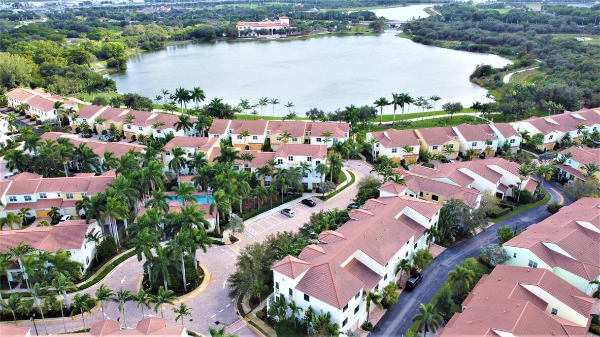 4866 Northwest 16th Avenue Boca Raton, FL 33431 - Photo 61 of 67 an aerial view of residential houses with outdoor space and lake view