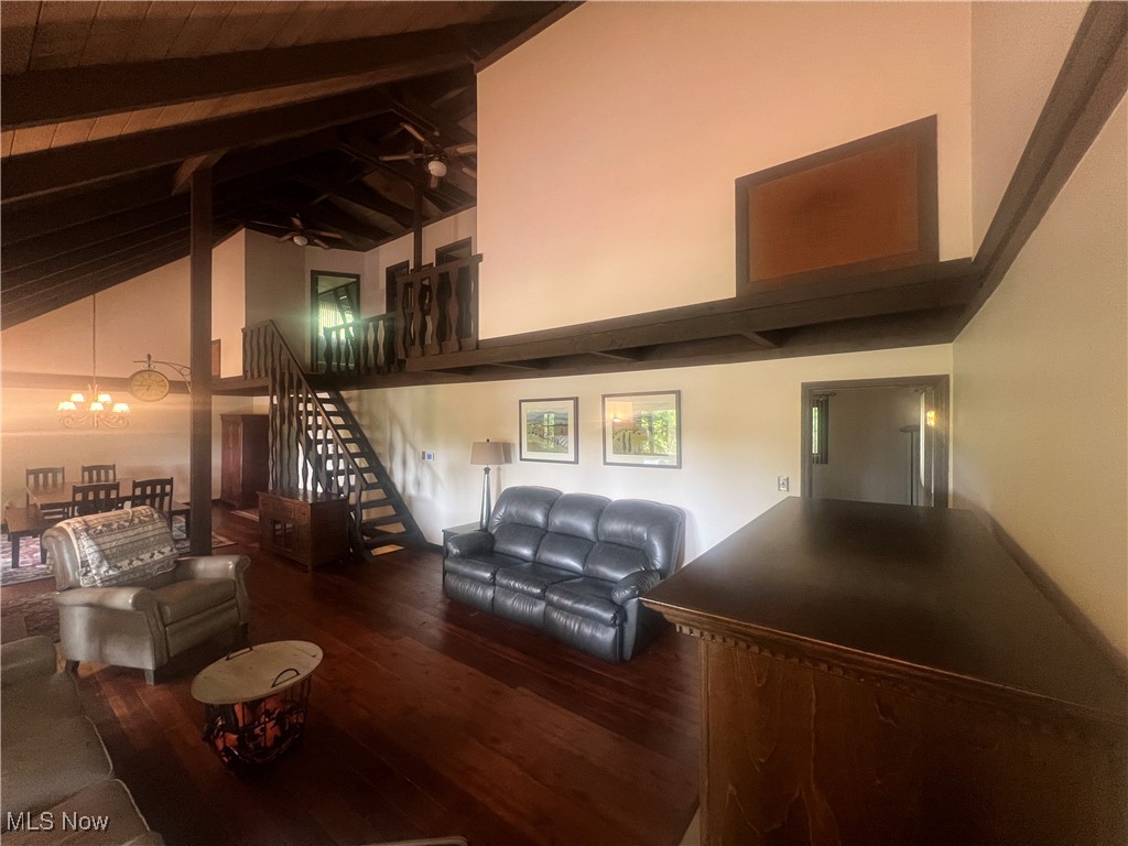 86301 North Bay Road Scio, OH 43988 - Photo 12 of 50 Living room featuring a notable chandelier, high vaulted ceiling, beamed ceiling, and hardwood / wood-style flooring