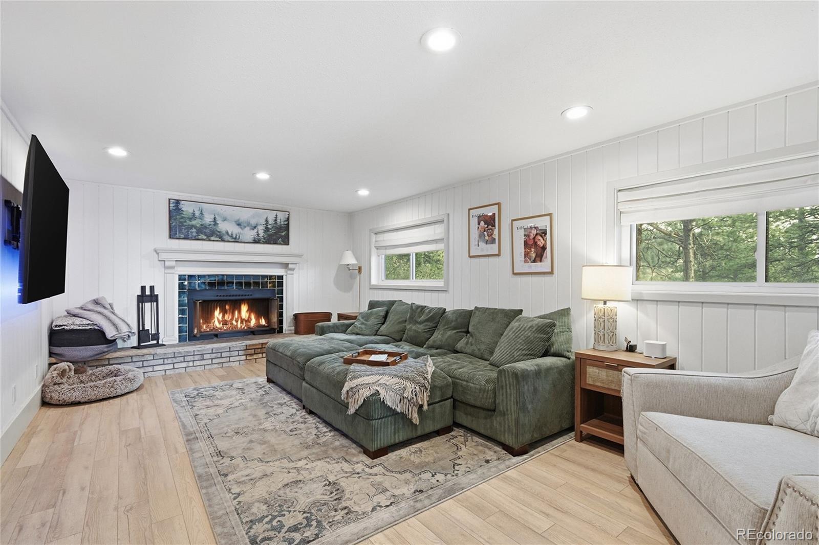 6387 High Drive Morrison, CO 80465 - Photo 11 of 49 a living room with furniture and a fireplace