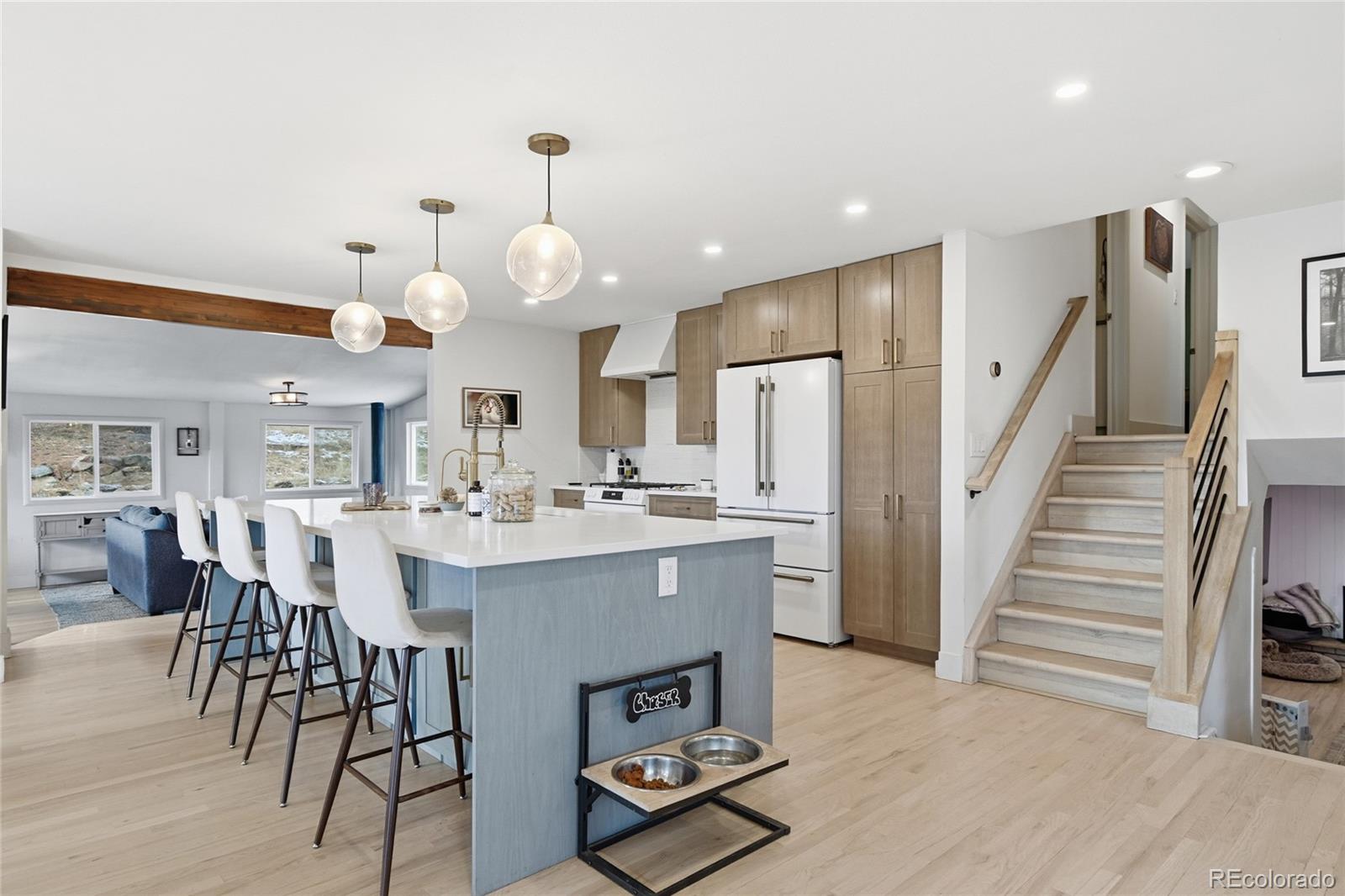 6387 High Drive Morrison, CO 80465 - Photo 15 of 49 a large kitchen with a table and chairs