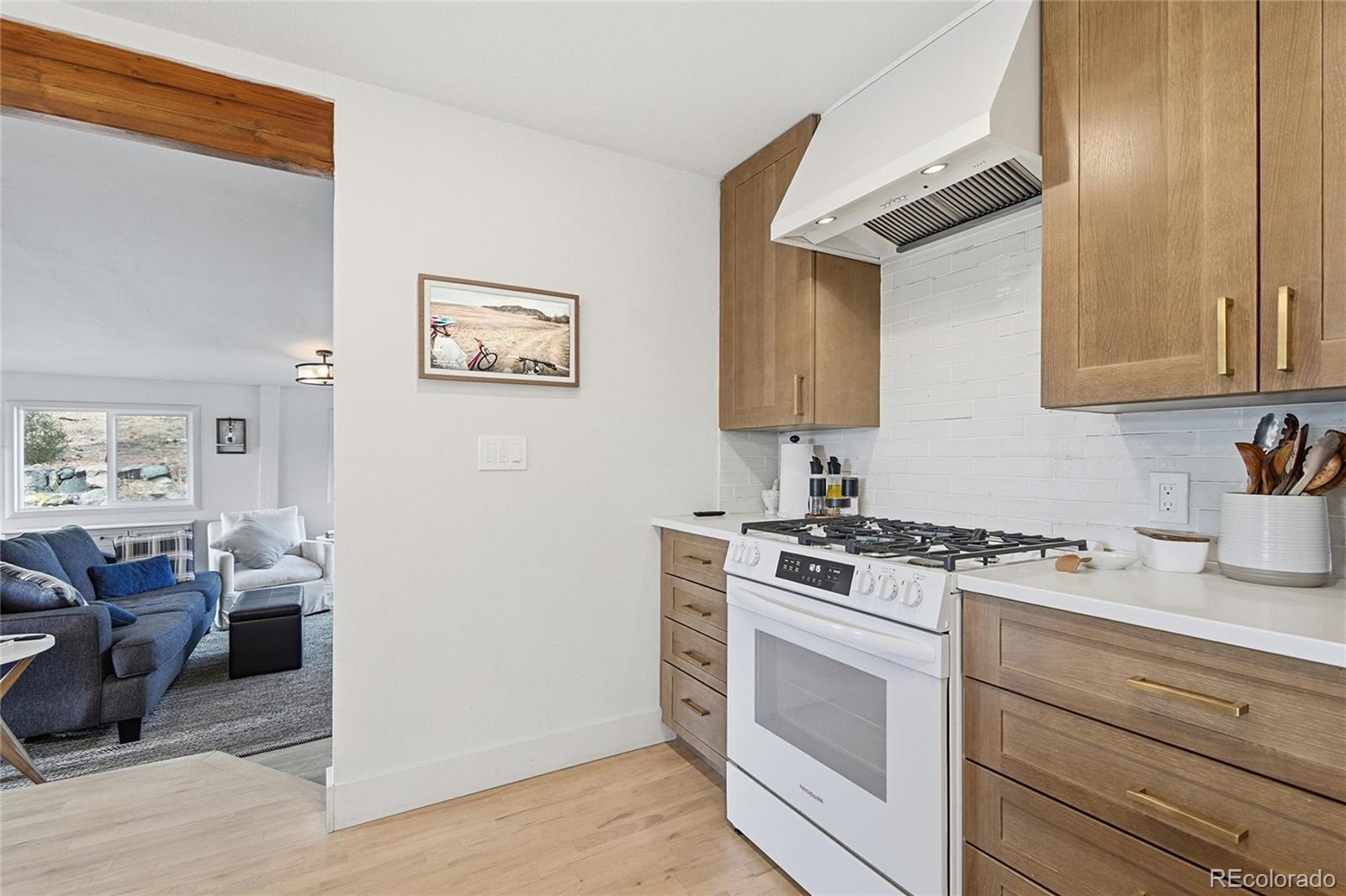 6387 High Drive Morrison, CO 80465 - Photo 18 of 49 a view of kitchen with stainless steel appliances granite countertop a stove and a sink