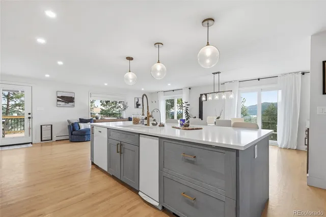 a kitchen with counter space and wooden floor
