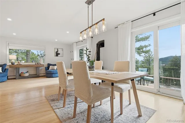 a view of a dining room with furniture window and outside view