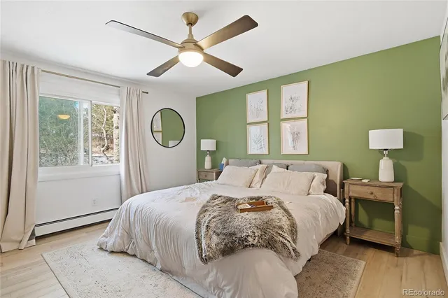 a bedroom with a large bed and a window