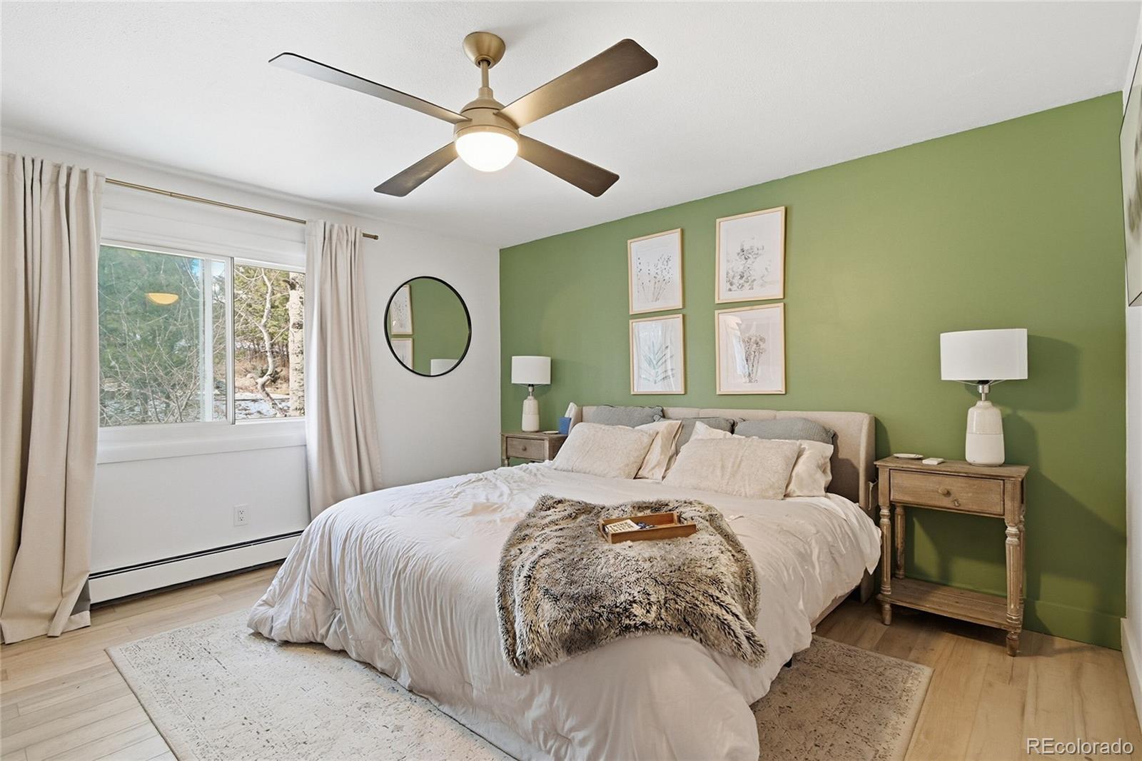 6387 High Drive Morrison, CO 80465 - Photo 22 of 49 a bedroom with a large bed and a window