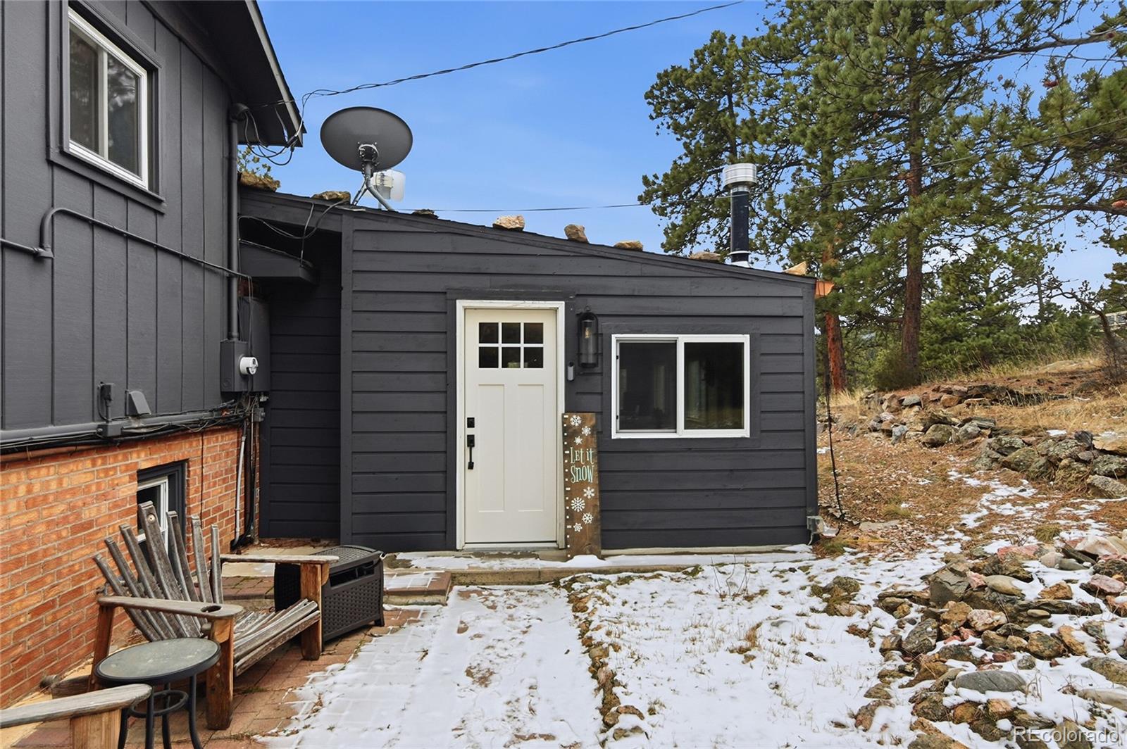 6387 High Drive Morrison, CO 80465 - Photo 3 of 49 a front view of a house