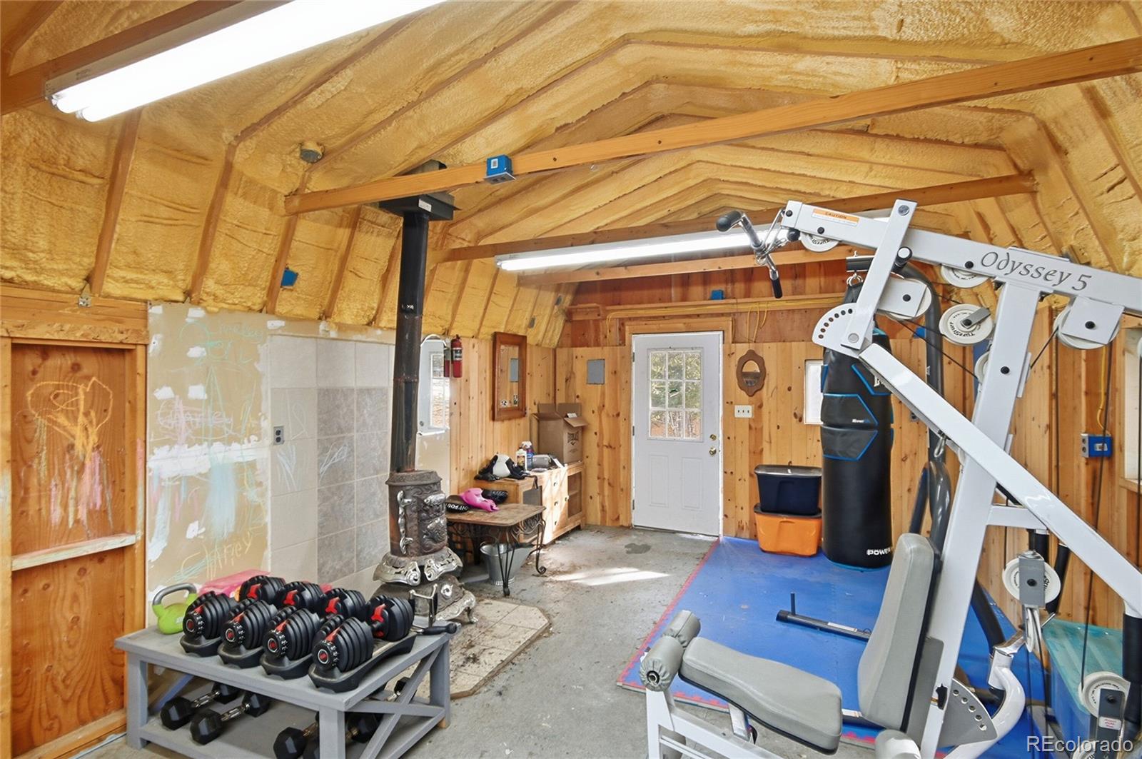6387 High Drive Morrison, CO 80465 - Photo 34 of 49 a living room with furniture and a chandelier
