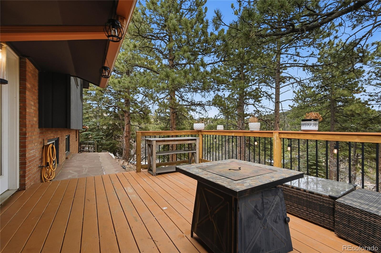 6387 High Drive Morrison, CO 80465 - Photo 35 of 49 a view of balcony with wooden floor and outdoor seating