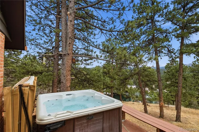 a view of jacuzzi with trees in the background